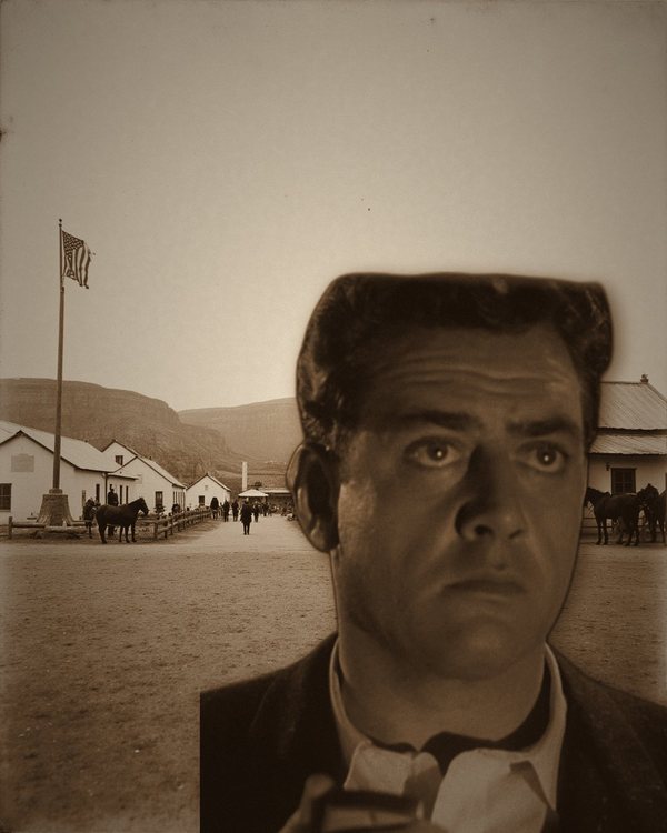 Black-and-white close-up of Raymond Burr in a jacket and open collar